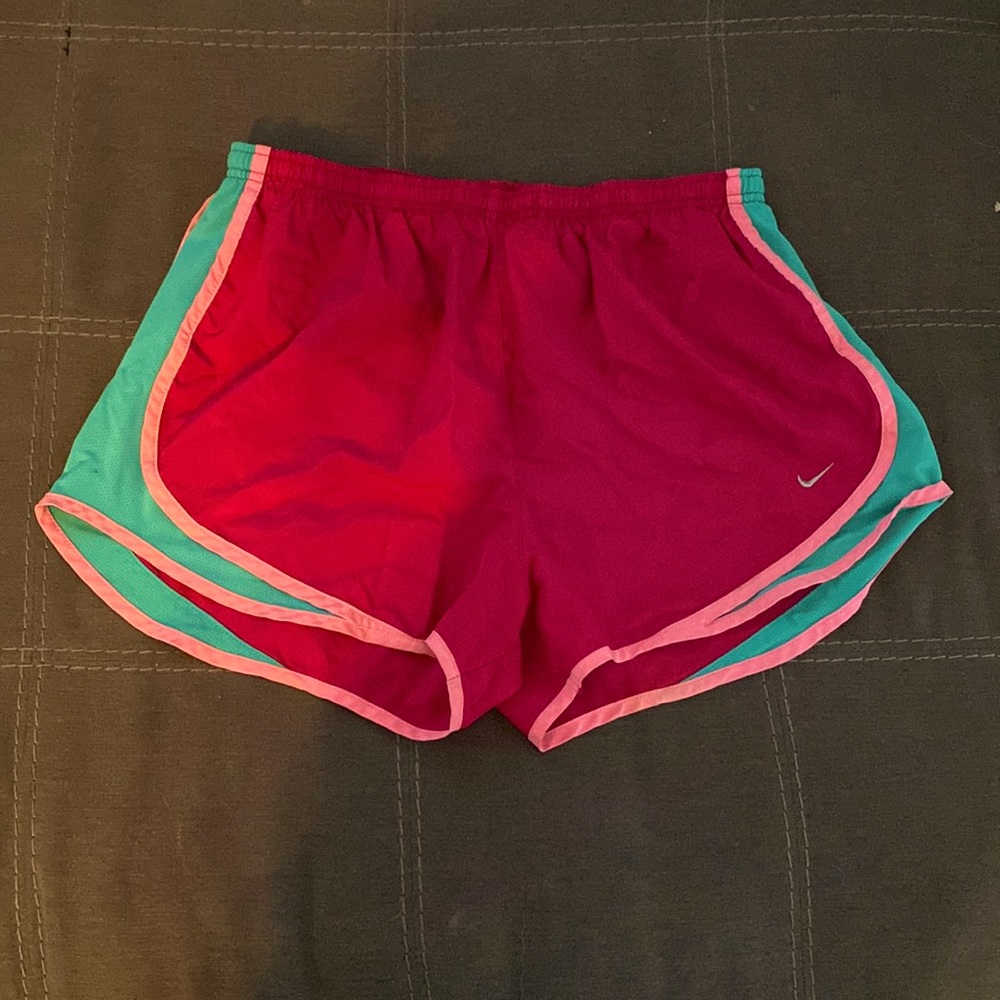 Pink is the color brand is Nike size is large